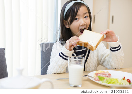A girl who eats bread A girl who eats bread 21055321