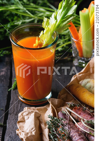 Colorful carrots and juice Colorful carrots and juice 21073784
