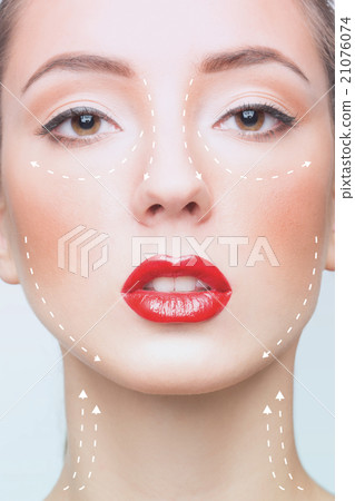 Portrait of young woman with arrows on her face 21076074