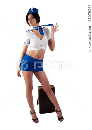 Young beautiful air hostess with vintage suitcase 21076285
