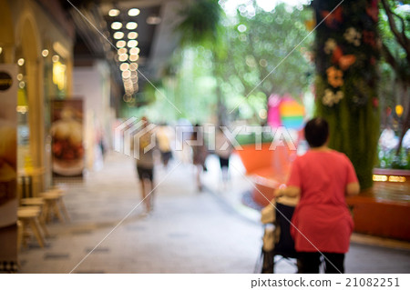 Blur people walking shopping green tree Blur people walking shopping green tree 21082251