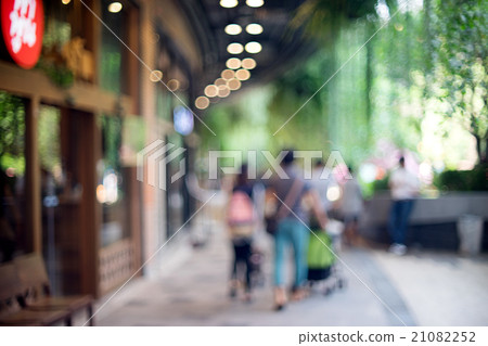 Blur people walking shopping green tree Blur people walking shopping green tree 21082252