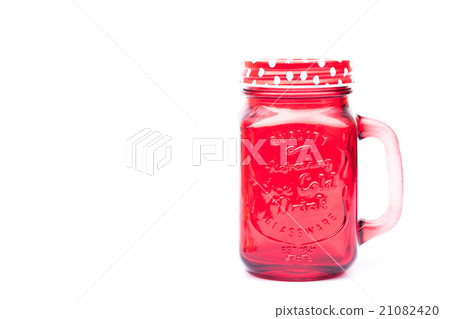 Red mason glass on white background Red mason glass on white background 21082420