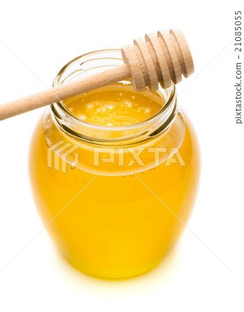 Natural honey in a glass jar, spoon for honey Natural honey in a glass jar, spoon for honey 21085055