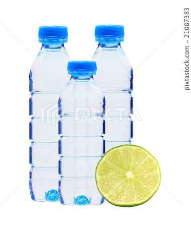 Blue bottles with water and fresh green lime Blue bottles with water and fresh green lime 21087383