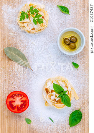 Italian food concept dried pasta with vegetables . 21087487