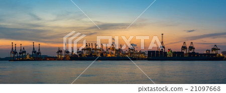 Cranes loading containers at a ship yard. 21097668