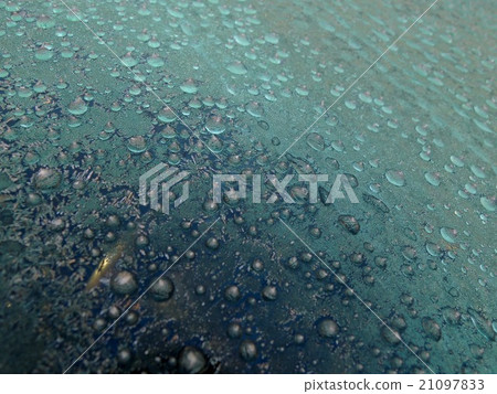 Ice granules on the windshield of the car 21097833