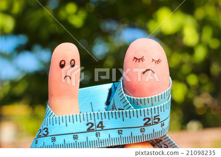 Finger art of couple with meter.  21098235