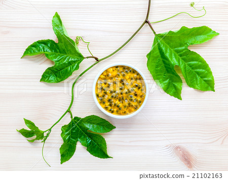 Fresh passion fruits set up on wooden background. Fresh passion fruits set up on wooden background. 21102163