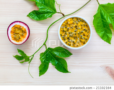 Fresh passion fruits set up on wooden background. Fresh passion fruits set up on wooden background. 21102164