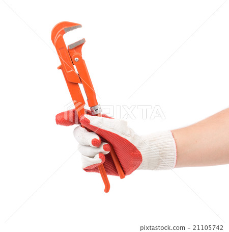 Hand in gloves holding gas wrench. Hand in gloves holding gas wrench. 21105742