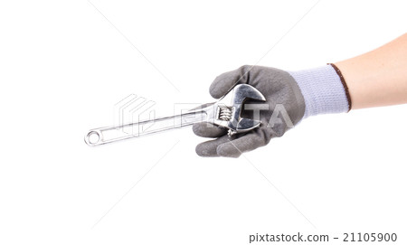 Hand in gloves holding wrench. 21105900