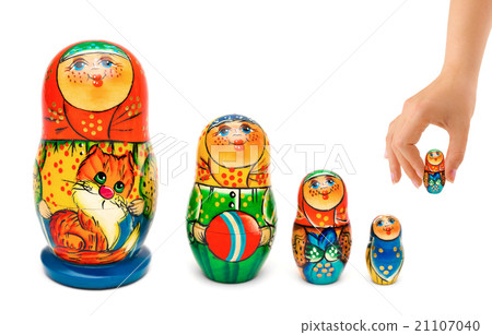 Hand and russian toy matrioshka Hand and russian toy matrioshka 21107040