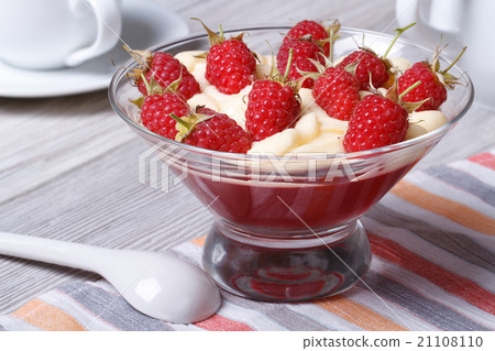 dessert of raspberries with cream and jelly 21108110