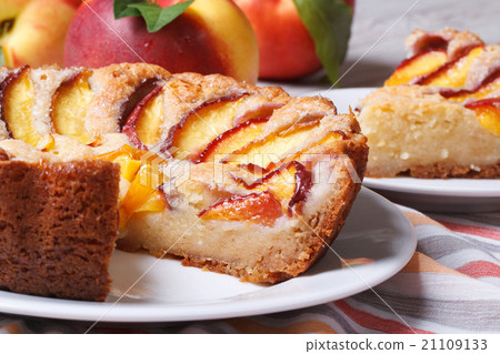Cut peach pie on the table close-up. horizontal 21109133