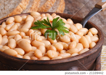 white kidney beans in a brown pot macro and bread white kidney beans in a brown pot macro and bread 21109442
