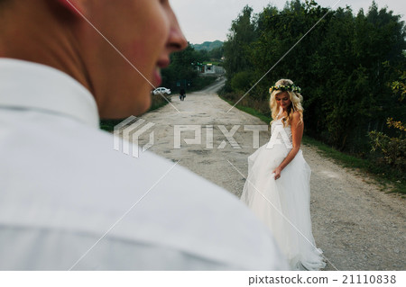 bride leads groom on the road bride leads groom on the road 21110838