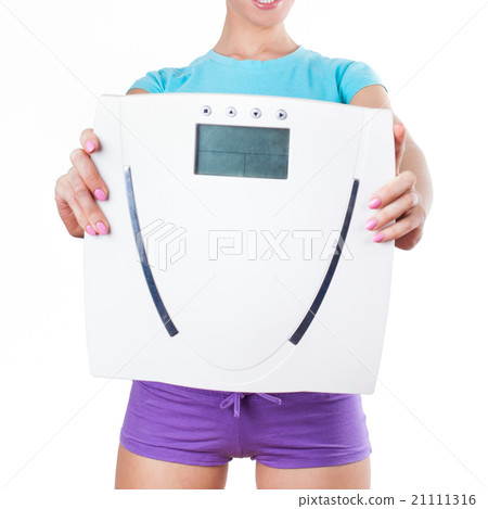 Diet and sport concept - woman shows scale Diet and sport concept - woman shows scale 21111316