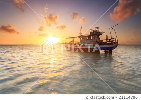 Fishing boat stand at sunrise beach in Phuket 21114796