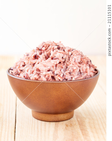 Bowl of steamed brown rice on wood table Bowl of steamed brown rice on wood table 21115101