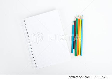 Note book and color pencils on table background 21115266