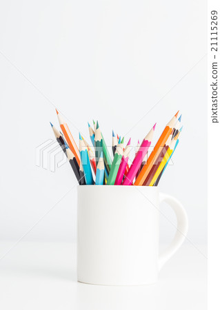 Color pencils in cup on white table background 21115269