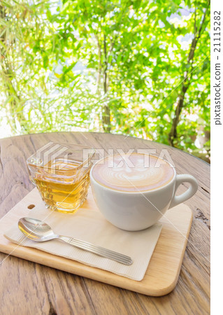 Cup of coffee latte art on wood table abstract blur background, Cup of coffee latte art on wood table abstract blur background, 21115282