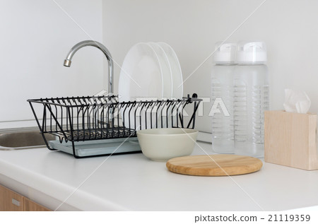 Utensil on white top counter sink Utensil on white top counter sink 21119359
