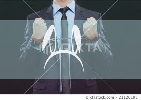 man in a business suit with chained hands 21120193