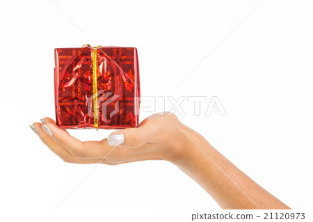 Woman's hand holding a red parcel Woman's hand holding a red parcel 21120973