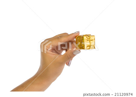 Woman's hand holding a golden parcel Woman's hand holding a golden parcel 21120974