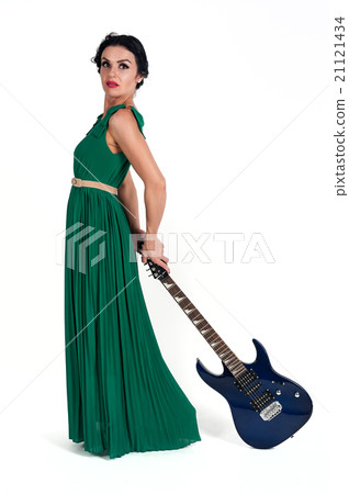 Pretty woman in long dress with guitar 21121434