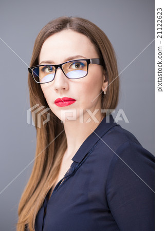 Young confident business woman in glasses Young confident business woman in glasses 21122623