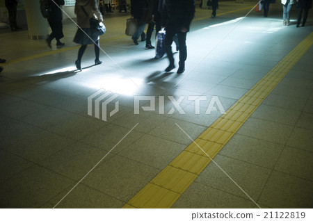 People walking underground walking space 21122819