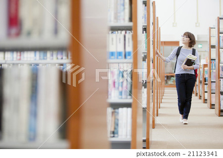 A student searching for a book A student searching for a book 21123341