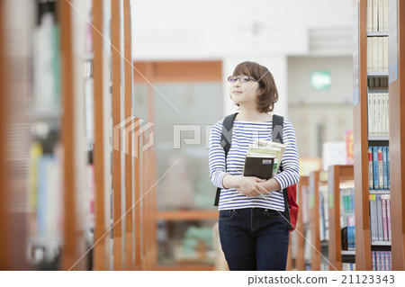 A student searching for a book A student searching for a book 21123343