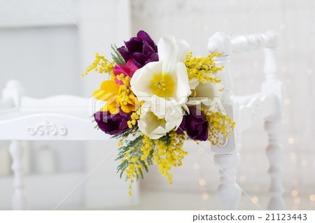 Bright spring bouquet of tulips and mimosa flowers 21123443