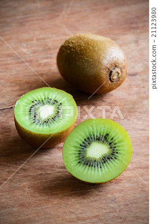 Fresh kiwi fruits on wooden background 21123980