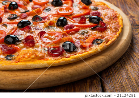 Delicious pizza with salami, mushrooms and olives Delicious pizza with salami, mushrooms and olives 21124281