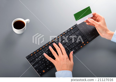 Woman's hands holding credit card. Woman's hands holding credit card. 21127016