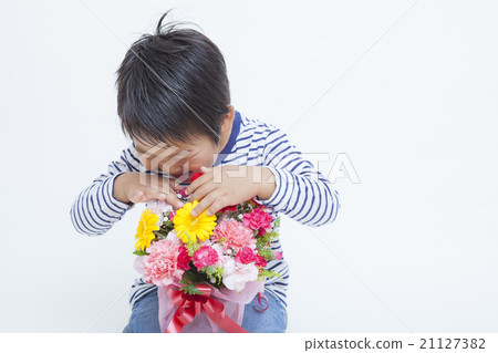 A boy with a bunch of carnations A boy with a bunch of carnations 21127382