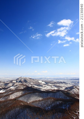 Mt. Moiwa seen from the mountain of Bodgei in the winter and the surrounding mountains Mt. Moiwa seen from the mountain of Bodgei in the winter and the surrounding mountains 21130840
