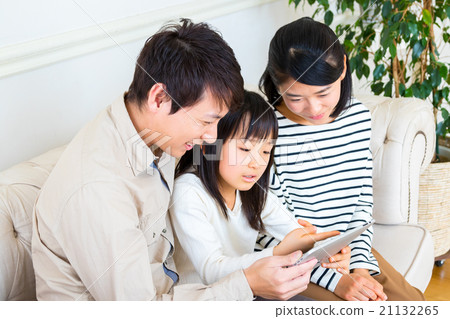 Three people using a tablet terminal Family Family Team Father Mother daughter Copy space Good family 21132265