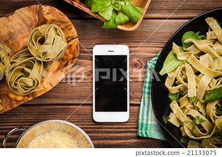 Cooked tagliatelle on a plate 21133075