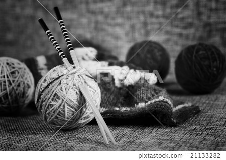 embroidery wool balls and knitting needles 21133282