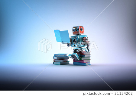 Robot sitting on a bunch of books. Clipping path 21134202