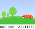 Tree of a hill and a red car 21144889