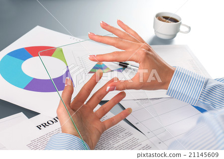 Female employee touching glass tablet. Female employee touching glass tablet. 21145609
