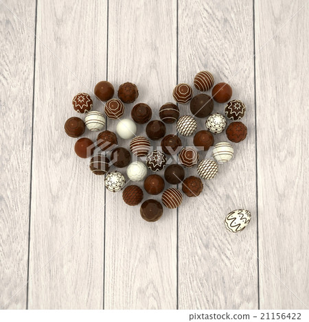 Chocolate Easter eggs heart on white wood 21156422